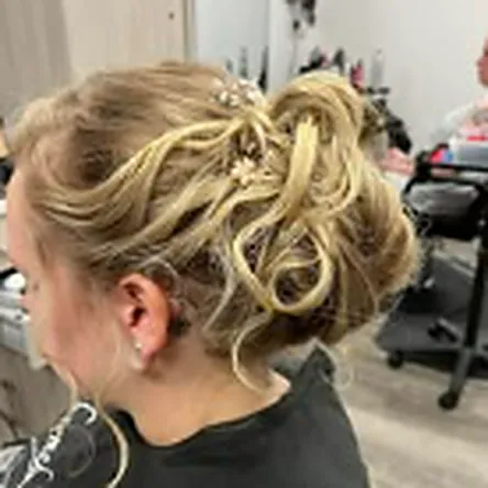 Soft blonde curled occasion updo styled at Charmed Beauty 9 & 18 in Toms River NJ
