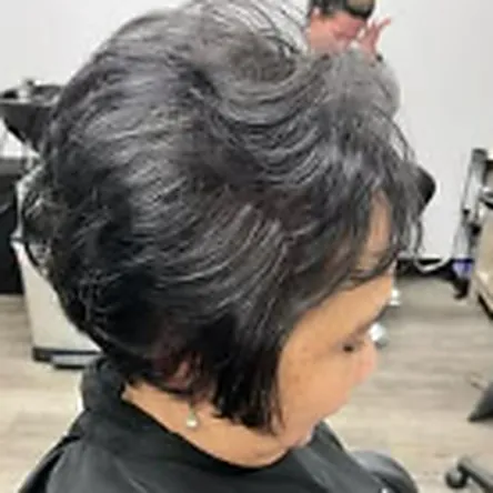 Precision layered short cut on silver hair