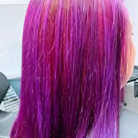 Vivid magenta hair colour on long straight hair