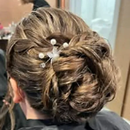 Bridal curled updo finished with pins